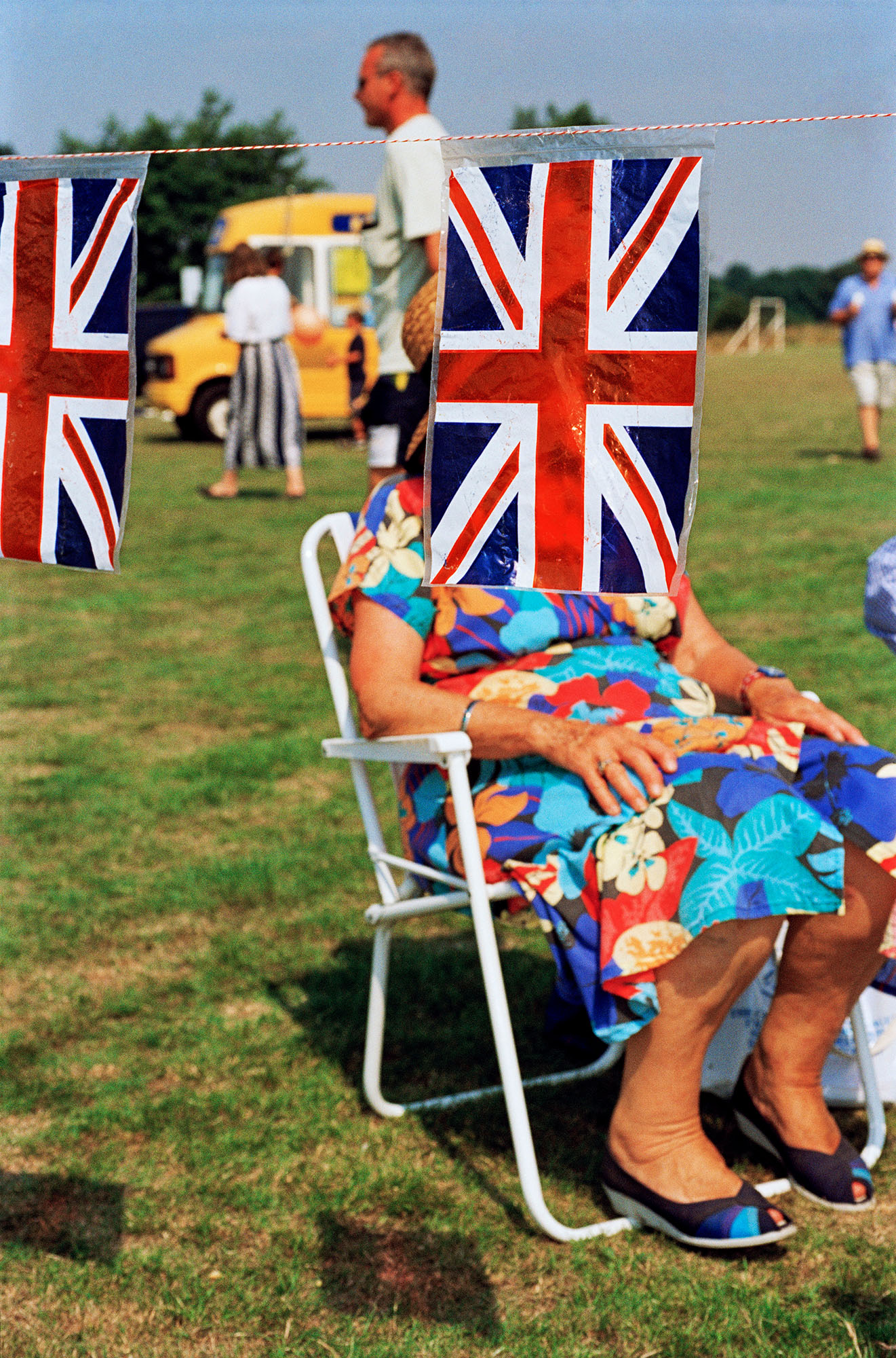 Photograph showing park scene blurred out behind union jack bunting.