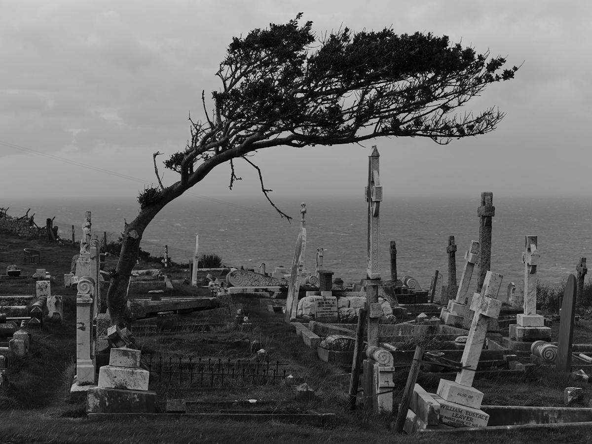 wind-swept graveyard on a hill top
